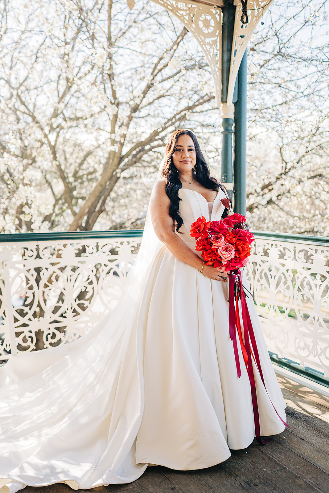 portrait of bride holding her bouquet on the balcony of harvest home