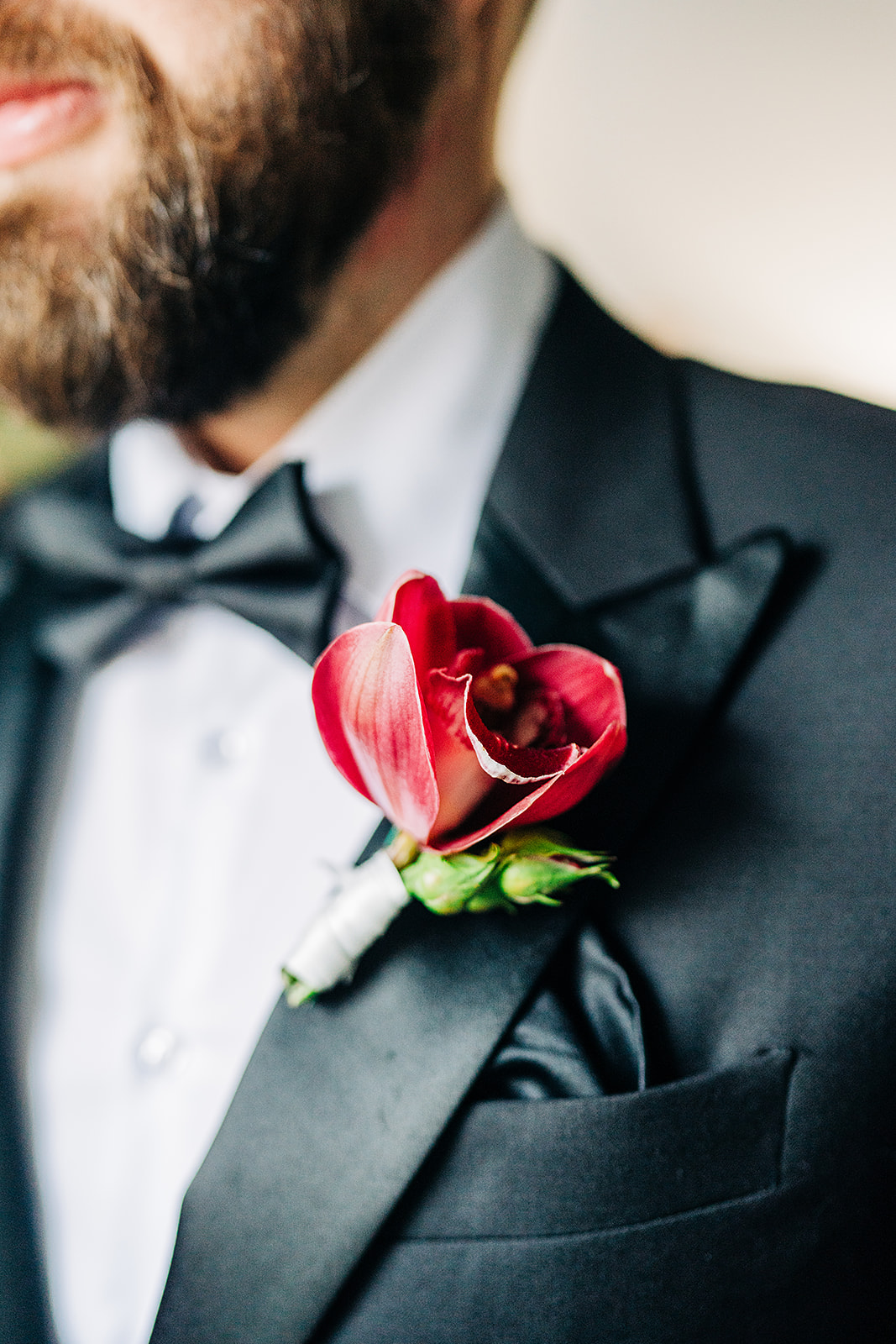 close up of grooms lapel flower
