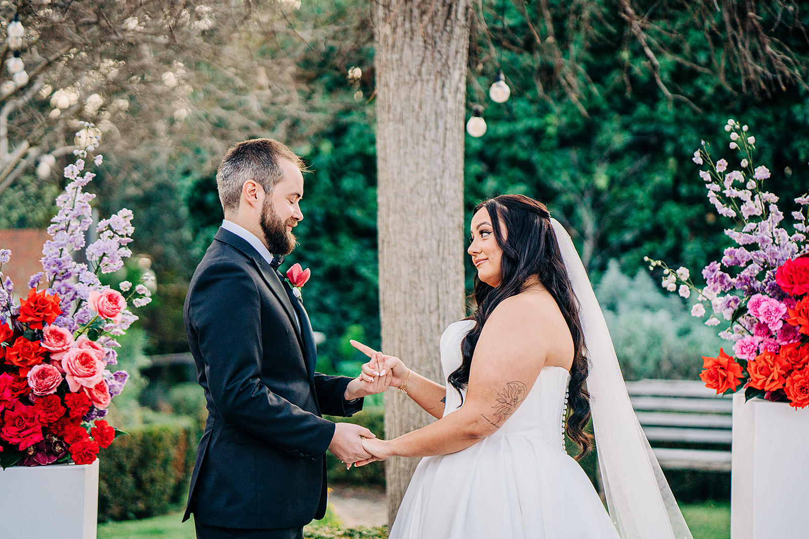 couple making silly faces to each other while their celebrant tells a funny story about them