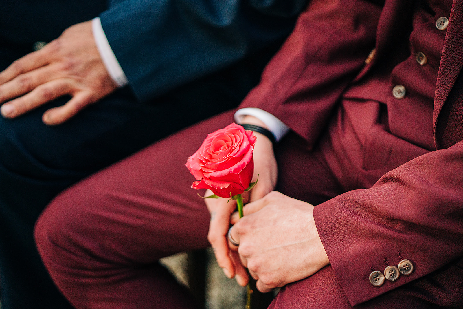 guest holding a flower