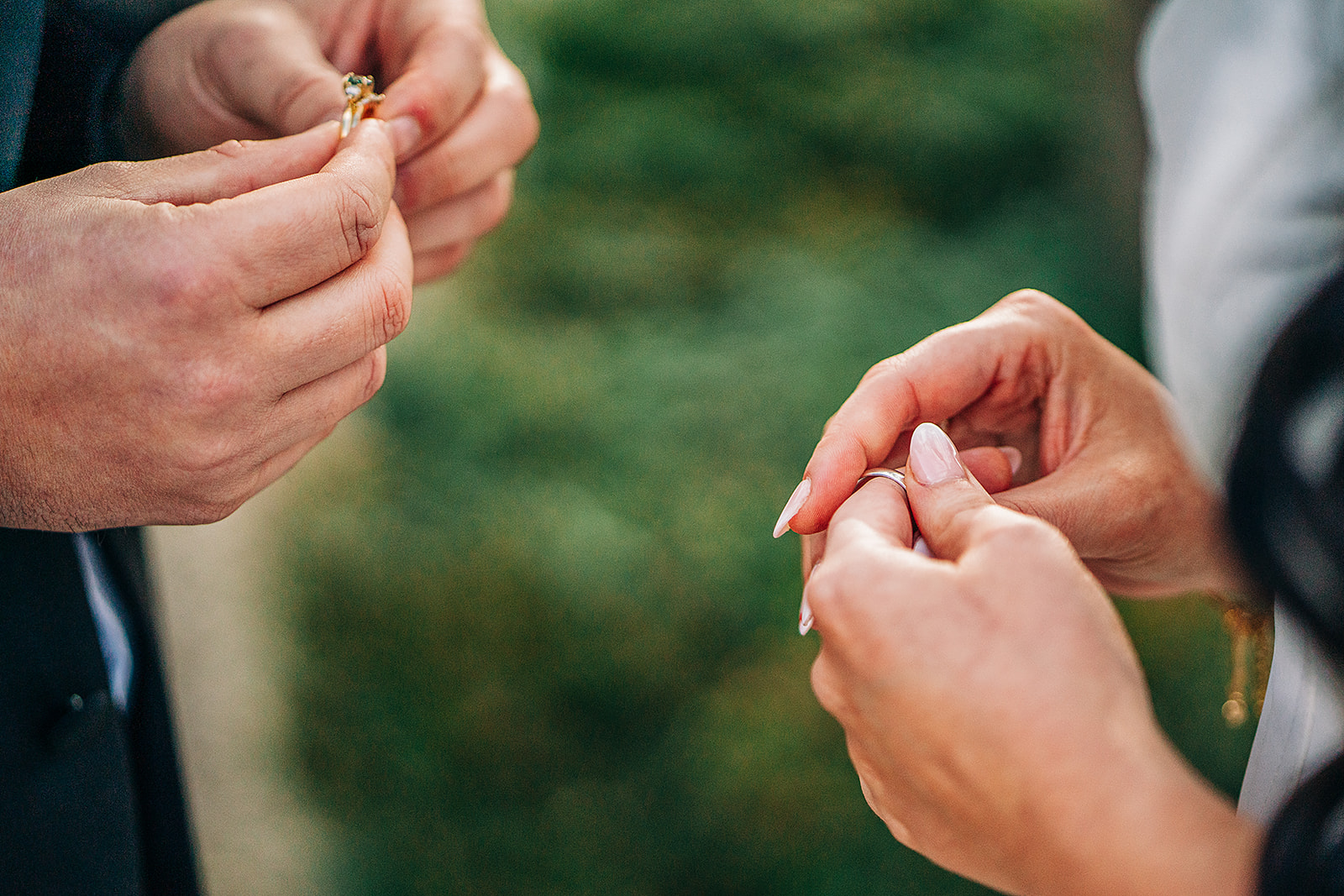 close up of hands hold their rings