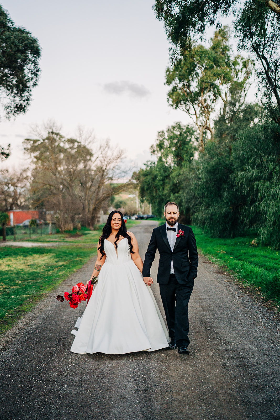 couple walking on dirt road outside harvest home avenel