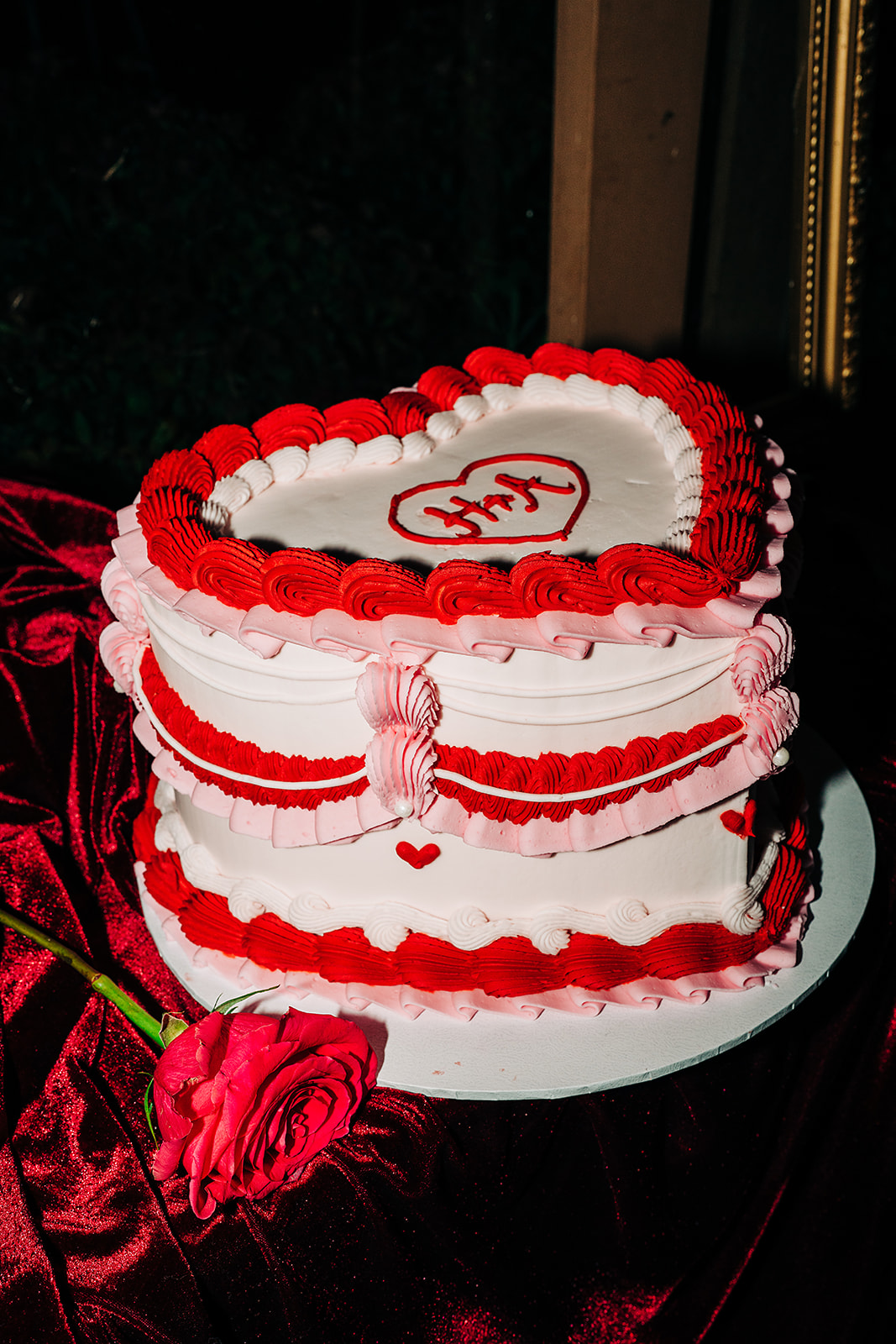 red pink and white heart shaped wedding cake