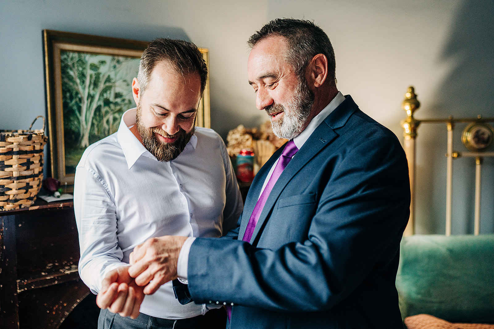 bride dad helping groom get ready