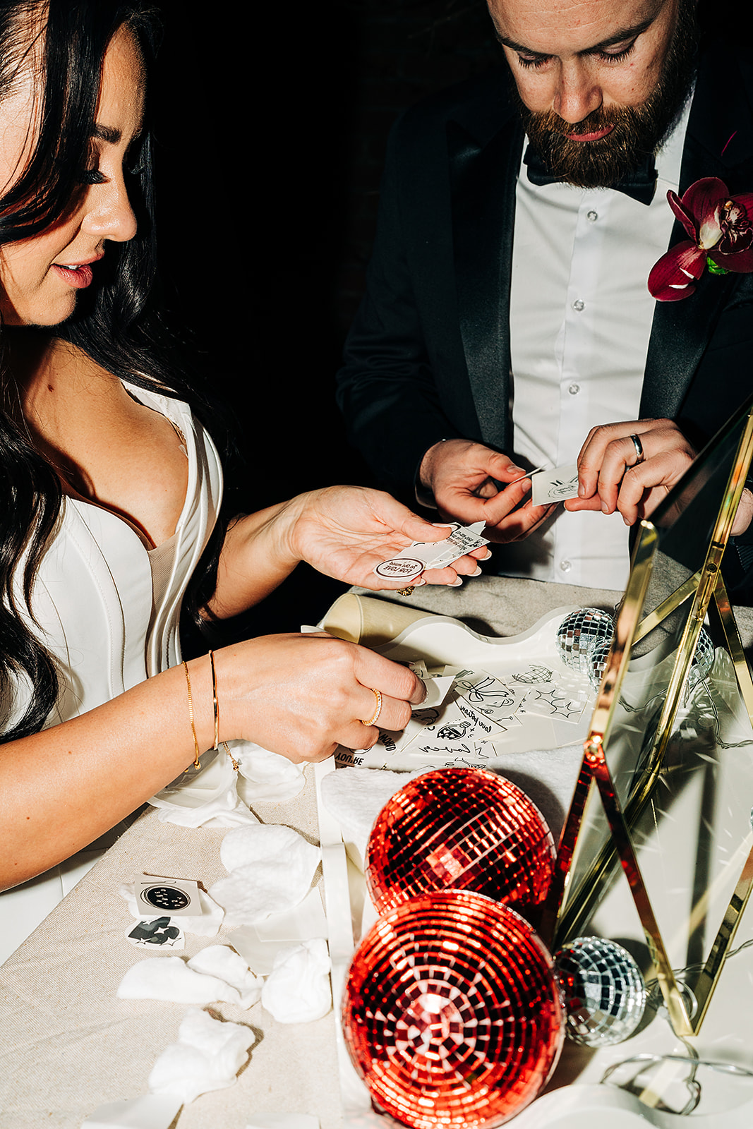 temporary tattoo station with red disco balls