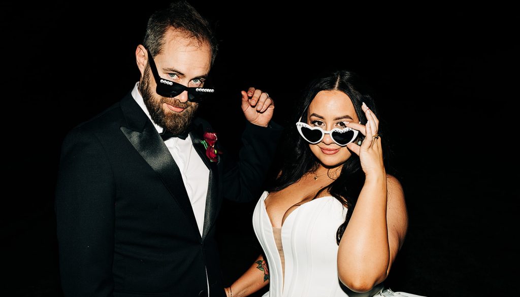 couple delivering all the sass with their wedding sunnies