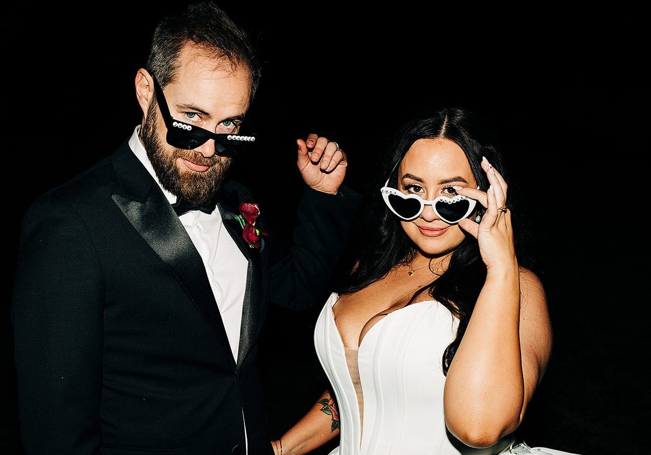 couple delivering all the sass with their wedding sunnies